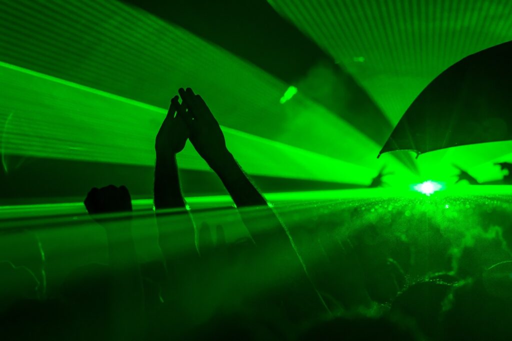 Dancers At A Club In Denver, Colorado Dance With Laser Lights A Glow