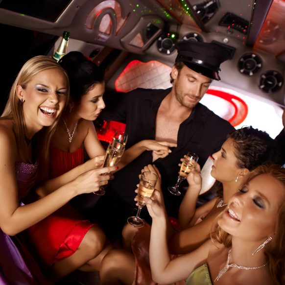 Hot bachelorette party party in limousine with handsome chauffeur and beautiful girls.